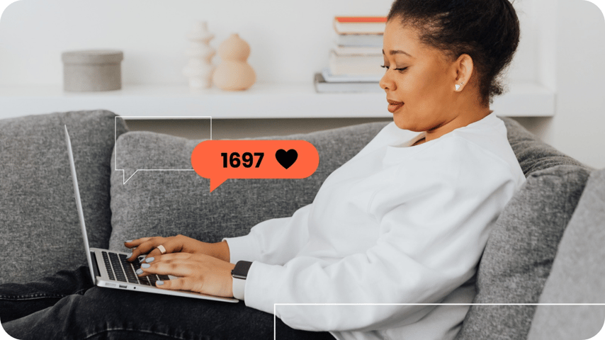 Woman on a sofa using a laptop, with a coral “1,697 ❤️” likes graphic overlaid.