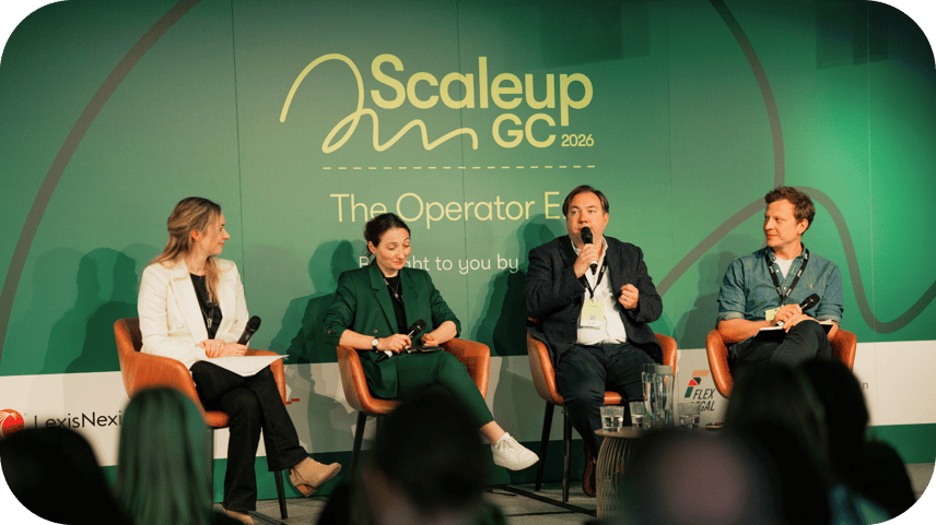 Panel discussion at the Scaleup GC event, with four speakers on stage discussing cyber attacks and cybersecurity risks.